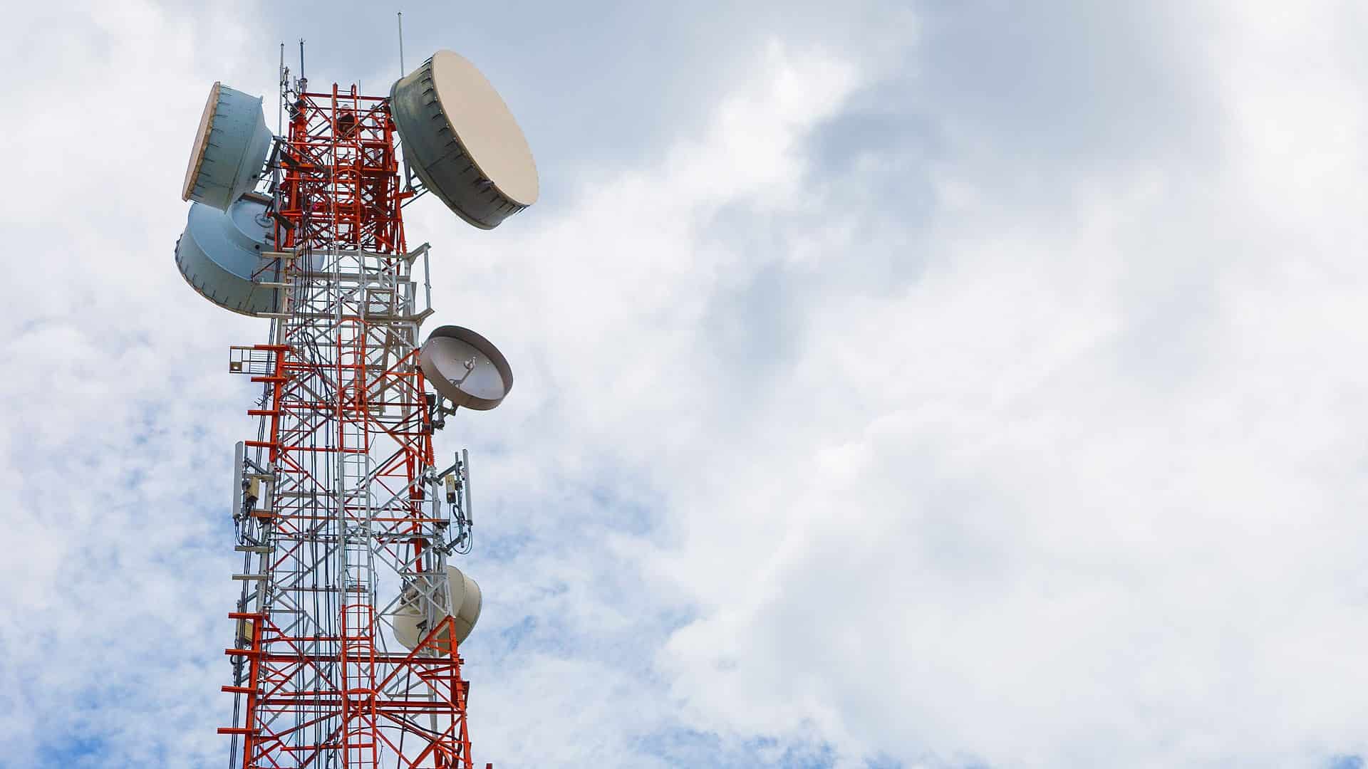 depositphotos 126702206 stock photo telecommunication tower against clody blue